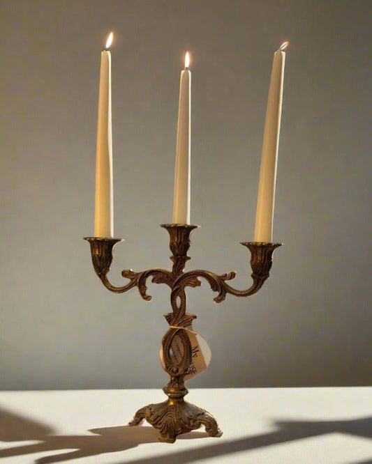 Vintage brass candleholder with bronze and gold finish, holds three candles, ornate decorative design