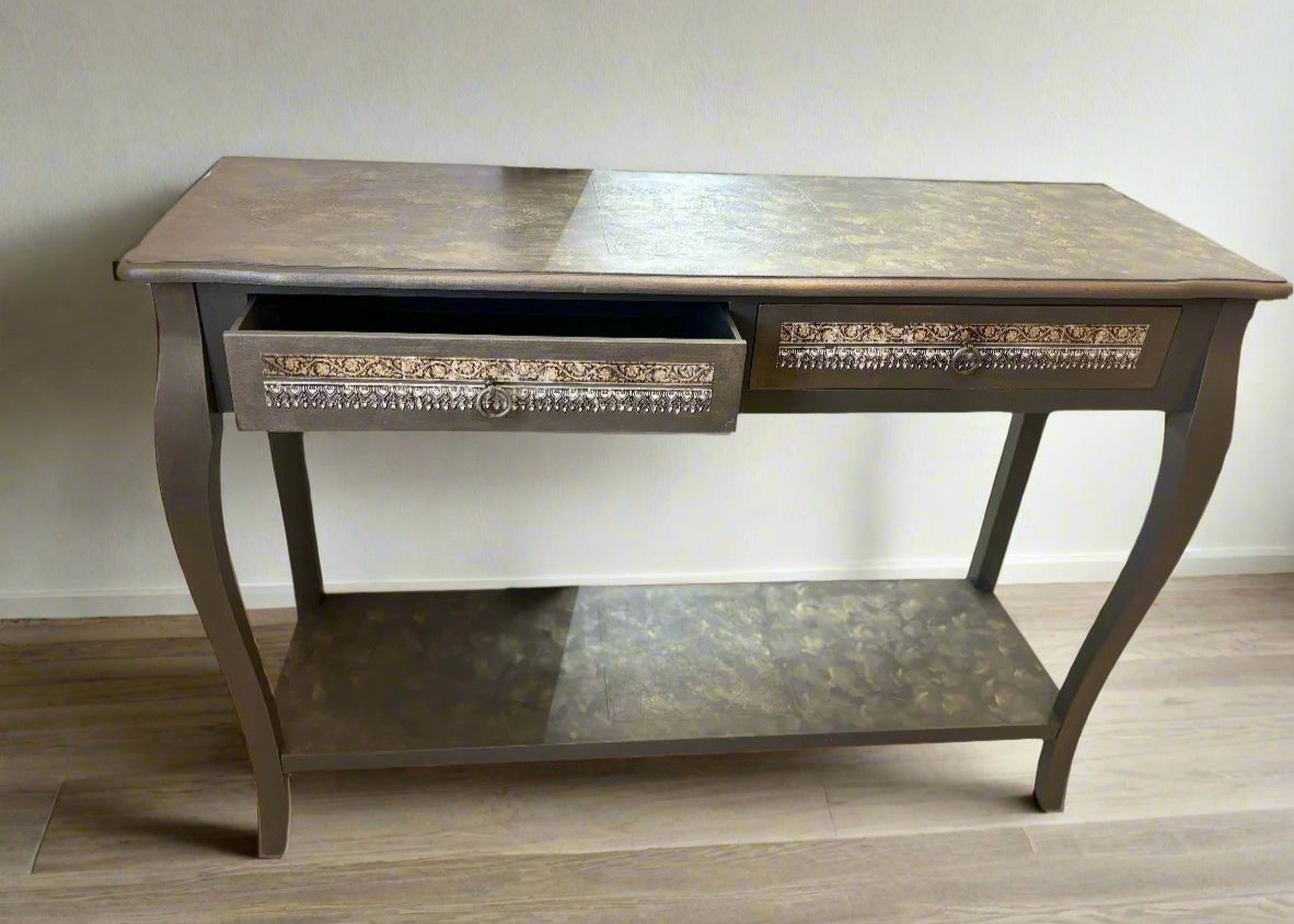 Refurbished vintage console table with a distressed wood finish and ornate carvings, perfect for adding character to entryways or living rooms. This stylish table combines classic design with modern functionality, making it ideal for displaying decor or as a chic storage solution.