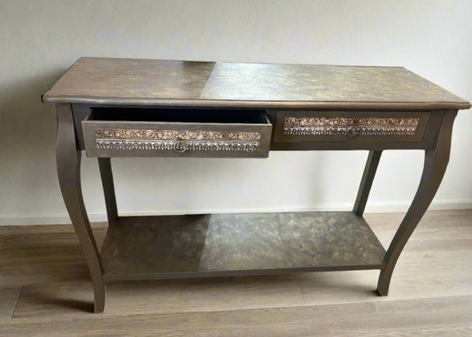 Refurbished vintage console table with a distressed wood finish and ornate carvings, perfect for adding character to entryways or living rooms. This stylish table combines classic design with modern functionality, making it ideal for displaying decor or as a chic storage solution.